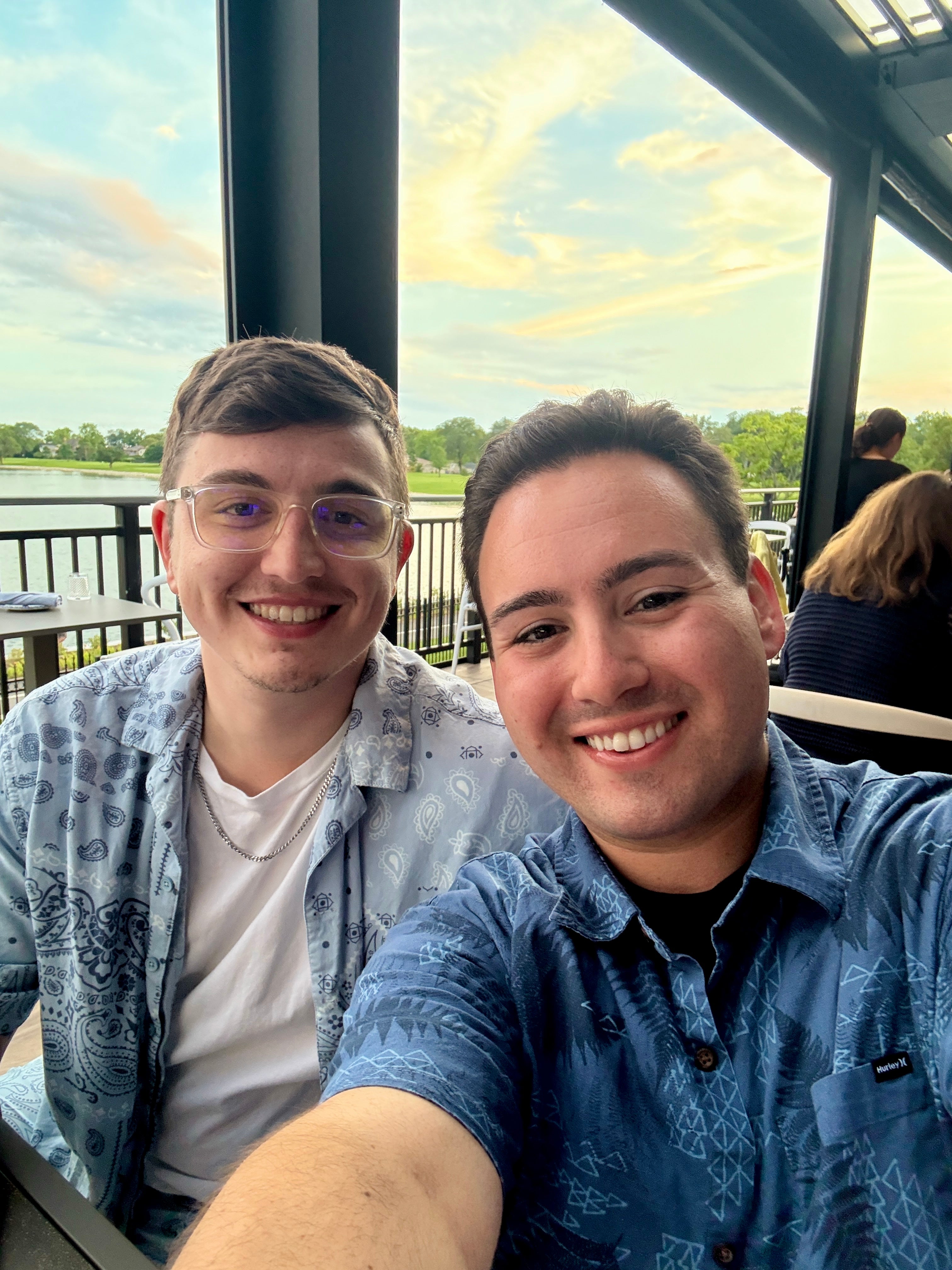 Two people sitting together with a scenic view outside